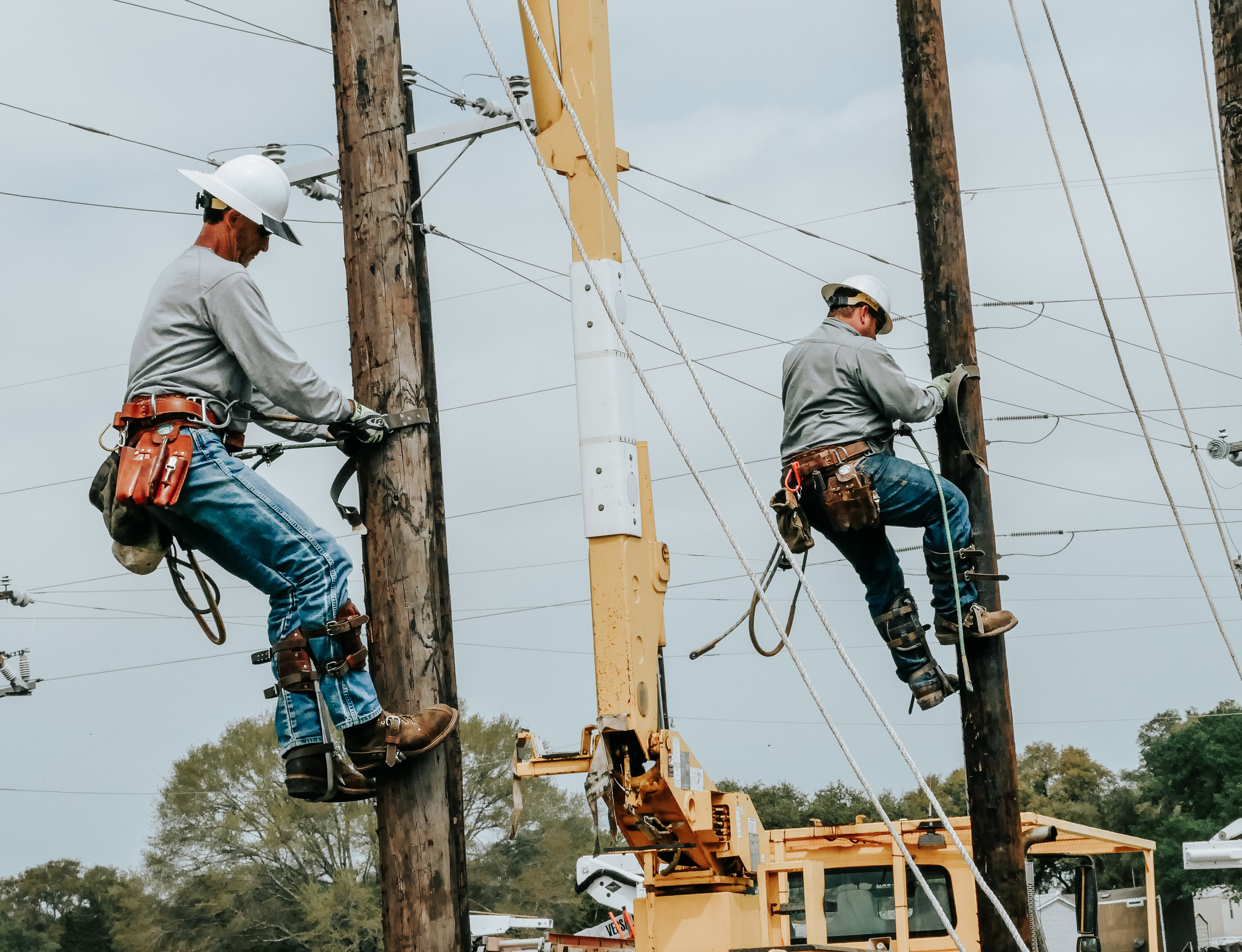 Lineman Climbing Poles